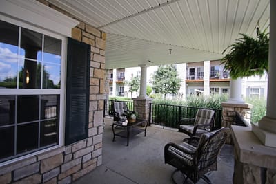 Covered outdoor seating area with views of greenery