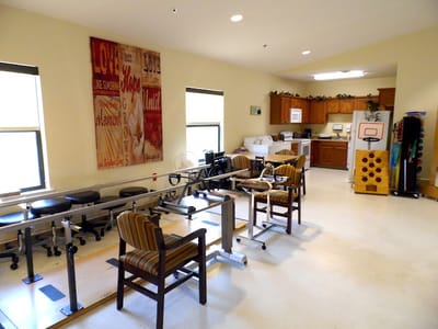 Well-equipped rehabilitation therapy room with equipment