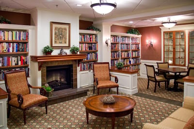 Cozy reading nook with bookshelves in a common area
