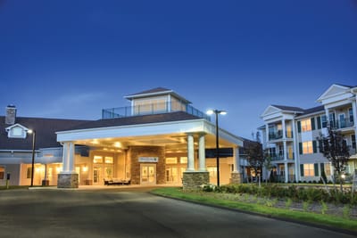 Exterior view of the facility entrance at dusk