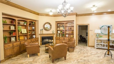 Cozy common area with seating and bookshelves