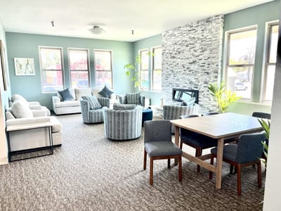 Bright common area with seating and dining space