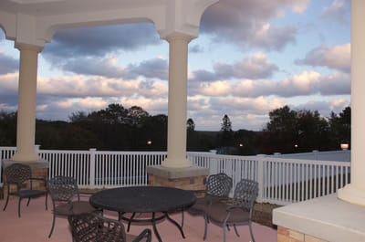 Outdoor seating area with tables and chairs.