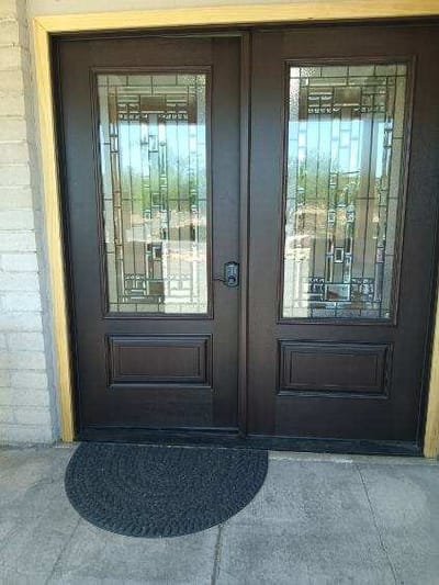 Elegant double doors with decorative glass panels
