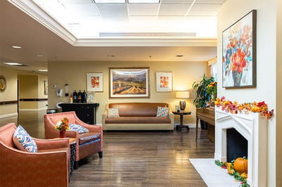 Cozy common area with seating and autumn decor