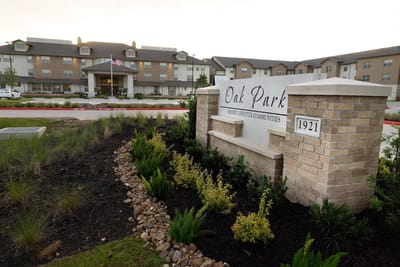 Exterior view of Oak Park Retirement Resort sign and building