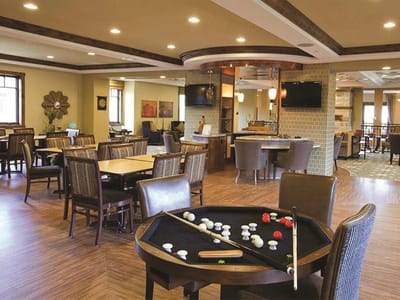 Common area with pool table and seating for residents