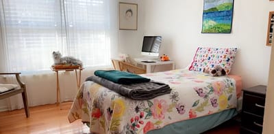 Cozy private resident room with a colorful quilt