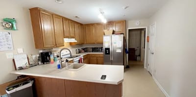 Bright kitchen area with wooden cabinets