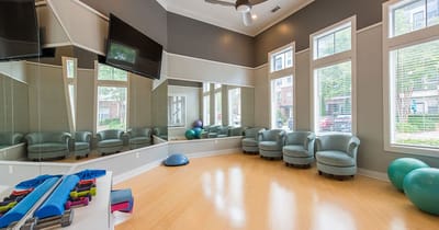 Bright interior fitness area with exercise equipment