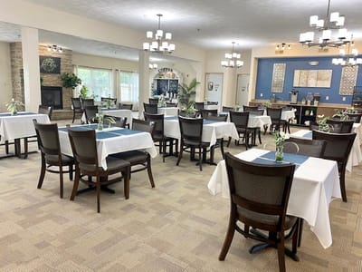 Bright dining area with tables and chairs