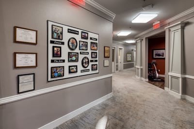 Interior hallway with framed pictures and exercise equipment