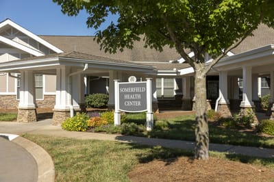 Exterior view of Somerfield Health Center with sign