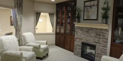 Cozy common area with comfortable seating and fireplace