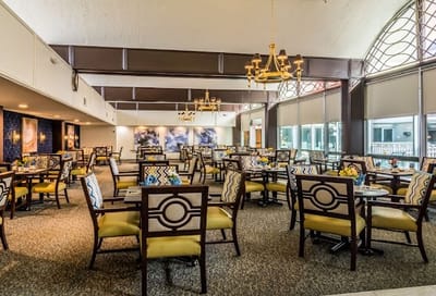 Bright dining room with tables and chairs