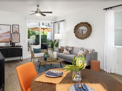 Bright common area with dining table and outdoor view