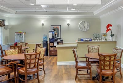 Dining area with tables and chairs in a well-lit space