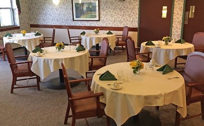 Dining room with tables set for a meal