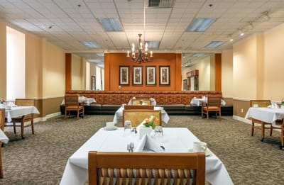 Elegant dining room setup with tables and chairs