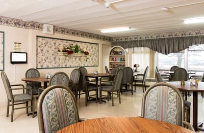 Bright dining area with tables and chairs