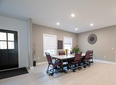 Bright common area with a large table and chairs