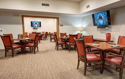 Bright common area with tables and chairs