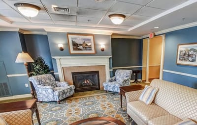 Cozy common area with seating and a fireplace