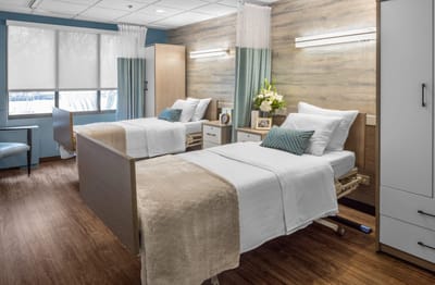 Bright interior of a resident room with two beds