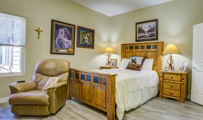 Cozy private room with wooden furniture and decor