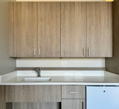 Interior view of kitchen cabinets in a resident unit