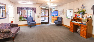 Bright common area with seating and decor