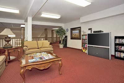 Cozy common area with seating and television