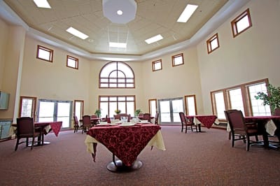 Dining area with round tables and large windows