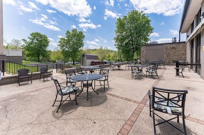 Outdoor patio area with tables and chairs