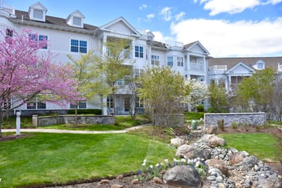 Exterior view of StoneRidge Senior Living with garden