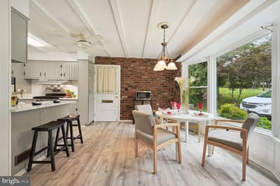 Bright kitchen area with dining table and outdoor view