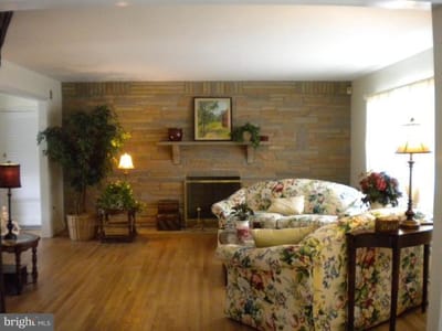 Cozy common living area with floral furniture