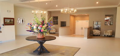 Well-decorated lobby area with floral centerpiece