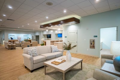 Bright common area with comfortable seating and decor
