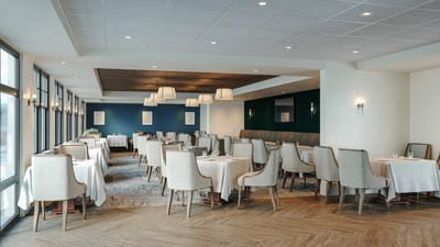 Elegant dining room with tables and chairs