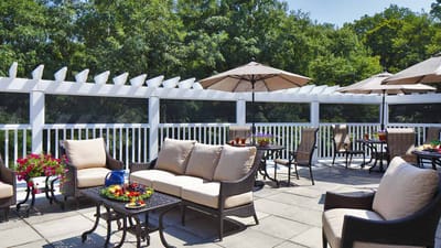 Outdoor patio area with seating and umbrellas