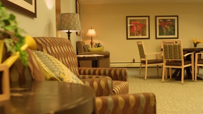 Cozy common area with comfortable seating and artwork