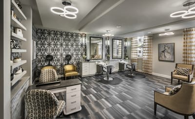 Brightly lit salon area with modern furniture