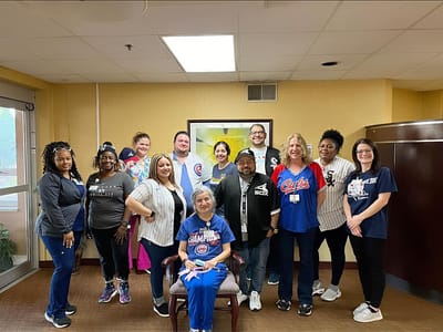 Staff and residents posing for a group photo