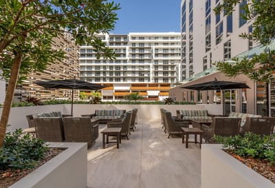 Outdoor seating area with lush landscaping