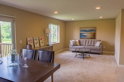 Bright interior space with a couch and dining area