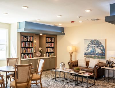 Cozy common area with bookshelves and seating