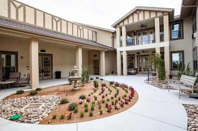 Outdoor courtyard with seating and flowers