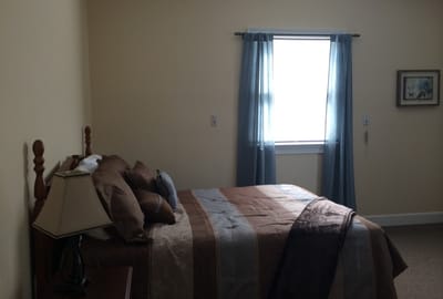 Cozy bedroom with a brown and blue color scheme