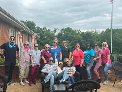 Staff and residents enjoying time outdoors in the garden